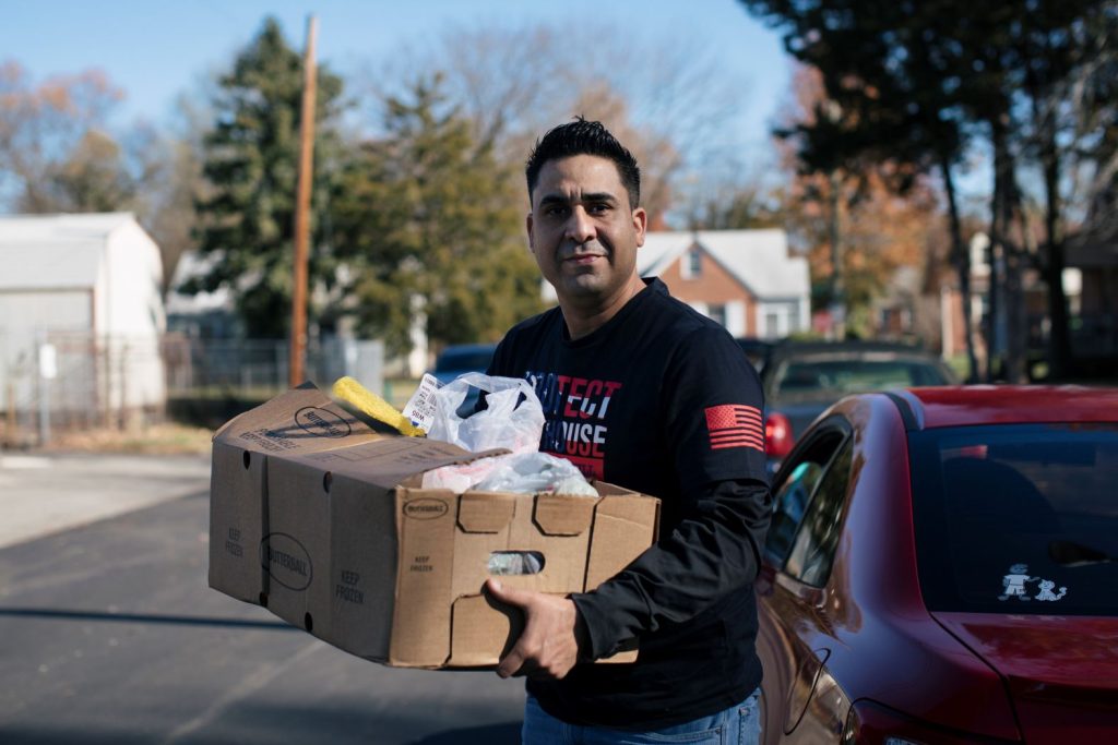 U.S. Army member receiving food at Ephesus Food Pantry