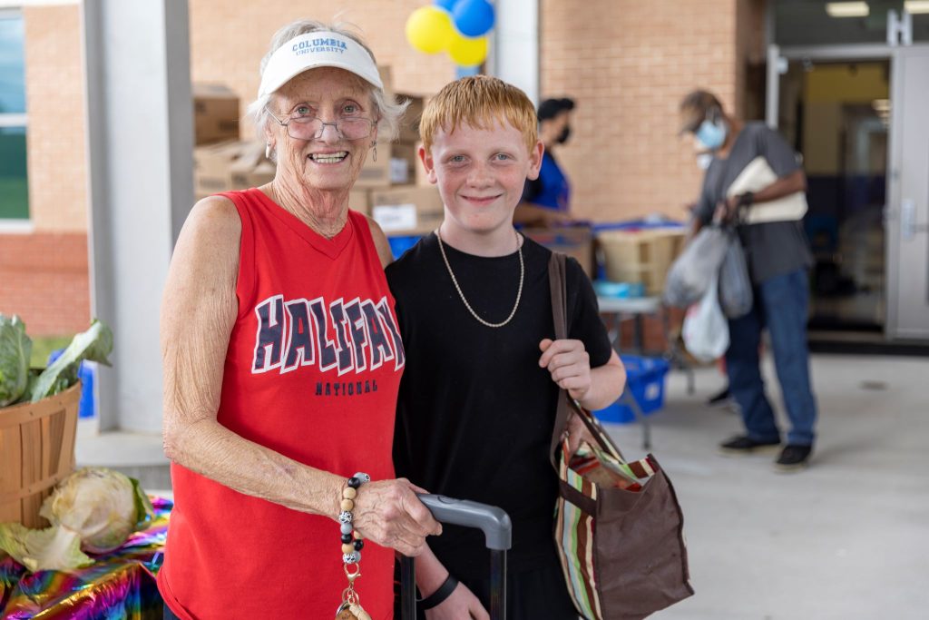 Grandmother and grandson at the South Boston Elementary School Market