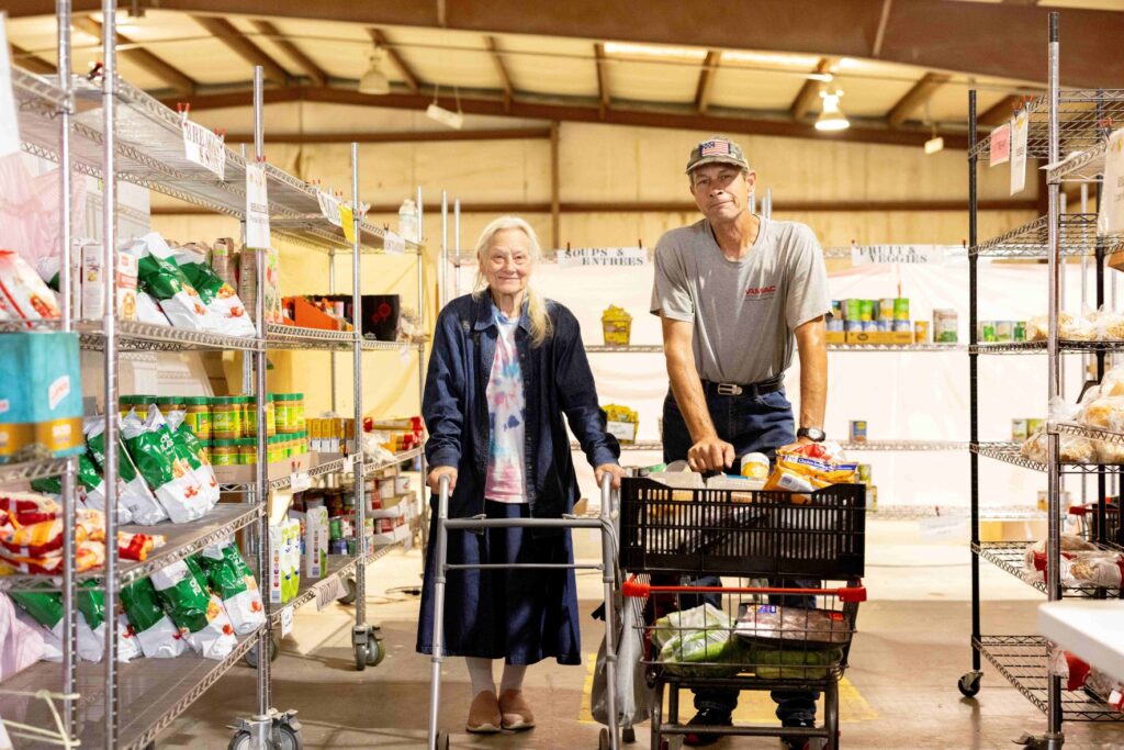 Mother and son Patricia and Robert shop at Promise Land Storehouse, a Feed More partner food pantry serving Charles City.
