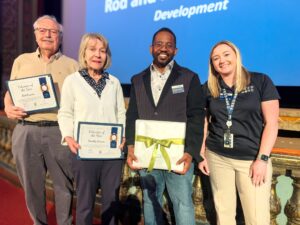 Feed More President and CEO Dennis Hatchett and HR Business Partner and Senior Manager Admistration Lauren Williams with Volunteer of the Year winners Rod and Dorothy Conner